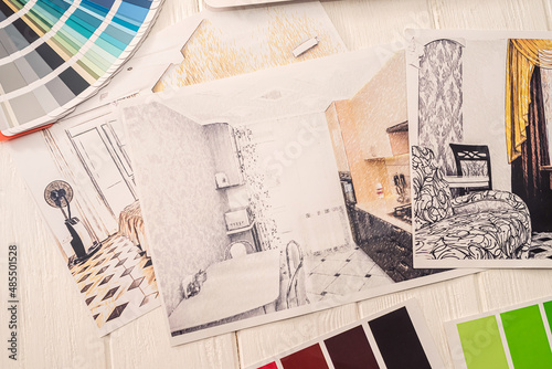 beautiful color palette with cool sketches spread out on a spacious table.