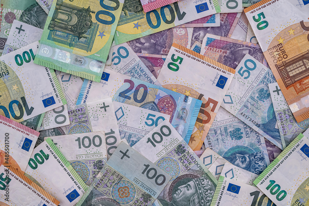 pile of polish banknotes zlotys and euros pile of polish banknotes zlotys and euros