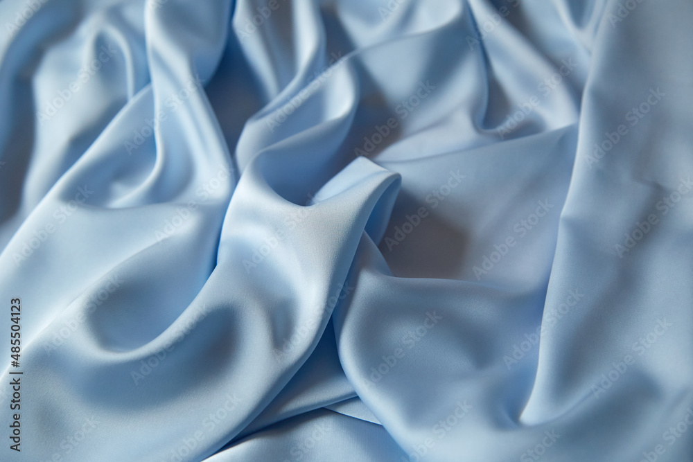 Obraz premium Beautiful draped silk fabric in blue.