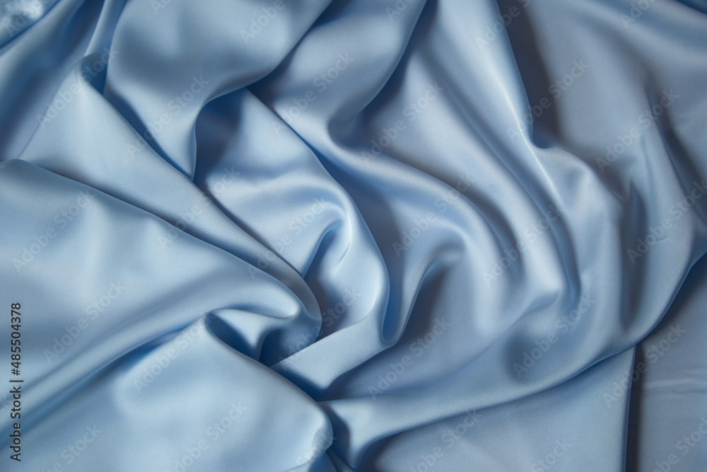 Obraz premium Beautiful draped silk fabric in blue.