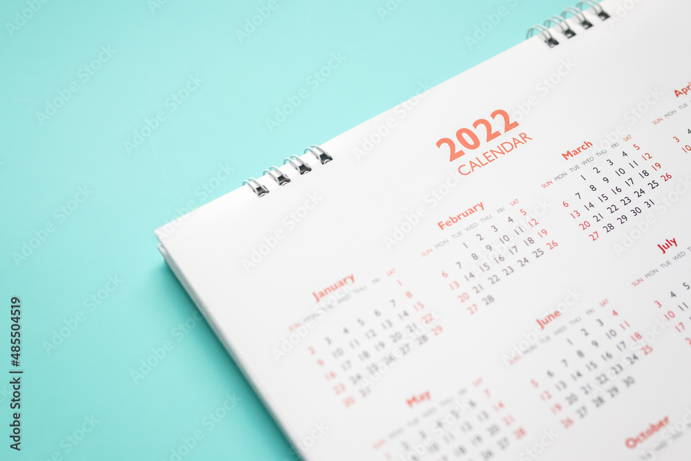 2022 calendar page on blue background business planning appointment meeting concept 2022 calendar page on blue background business planning appointment meeting concept