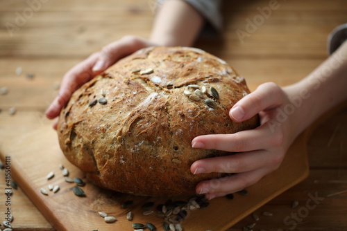 Girl's hands holding bread