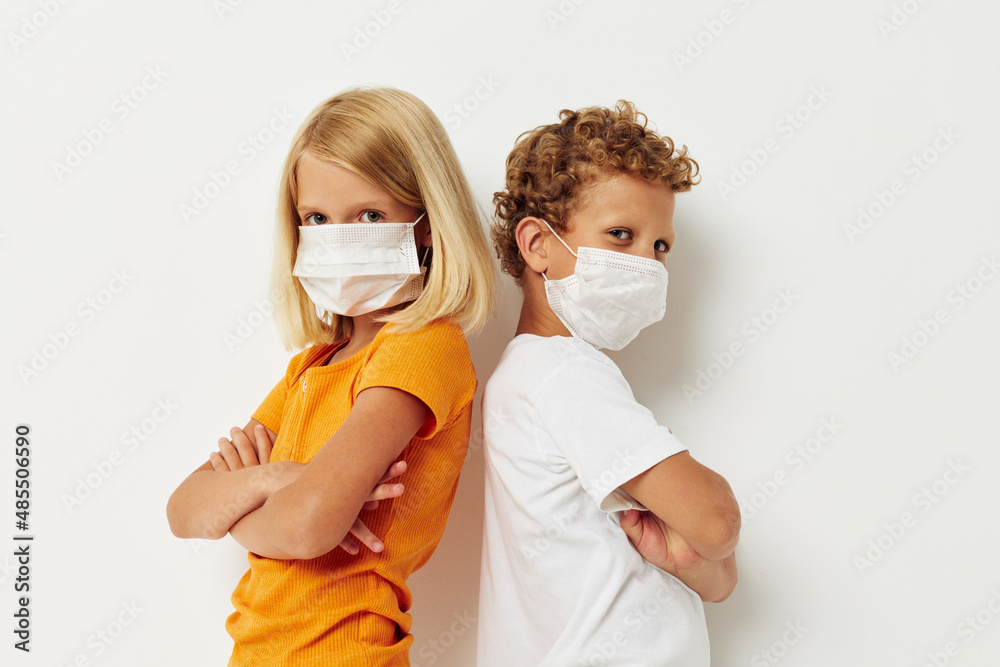 cheerful children in medical mask protection posing grimace lifestyle unaltered