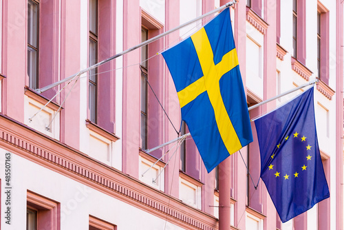 Sweden and euro union flags flags on the wall photo