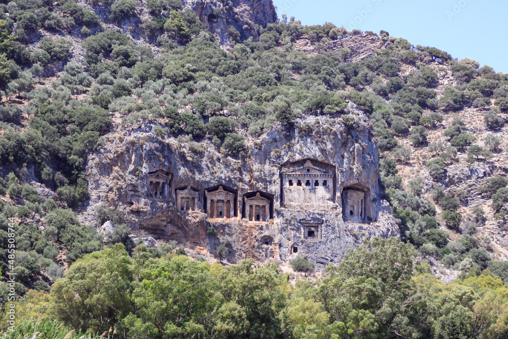 Koycegiz, Mugla, Turkey - July 12 2017: The rock tombs of the kings in the ancient city of Kaunos in Koycegiz Dalyan