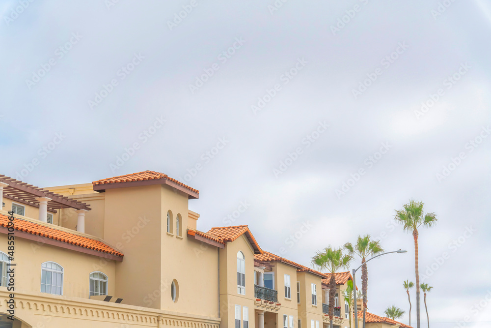 Apartment building with clay tiles roofing and balconies at Carlsbad, San Diego, California