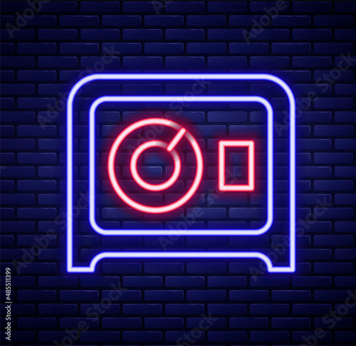 Glowing neon line Safe icon isolated on brick wall background. The door safe a bank vault with a combination lock. Reliable Data Protection. Colorful outline concept. Vector