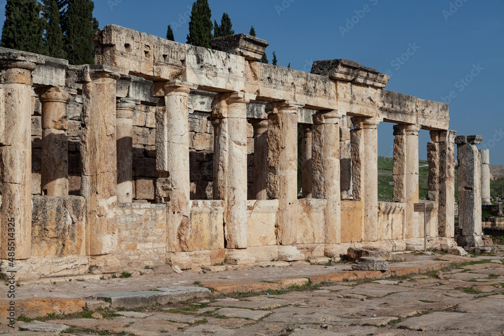 Pamukkale, Denizli, Turkey: April 03 2016: Monolithic doric columns of The public latrine along Frontinus street in Hierapolis