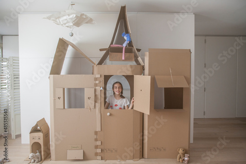 original cardboard house with kid inside