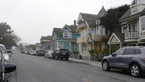 Row of old victorian style houses, historic residential district, Monterey, California USA. Colonial architecture, retro vintage suburban wooden classical cottages. Real estate property, city street.