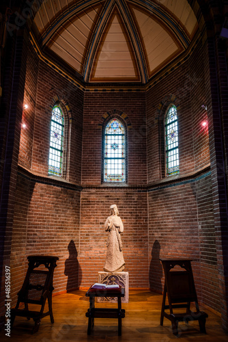 A statue of a holy person in the middle of a church in a monastery