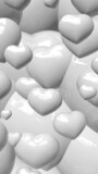zoom on White shinny hearts in portrait format
