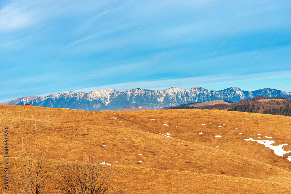 Obraz premium Mountain range of Monte Baldo (Baldo Mount) in winter view from Lessinia Plateau Regional Natural Park. Velo Veronese municipality, Verona Province, Veneto and Trentino-Alto Adige, Italy, Europe.