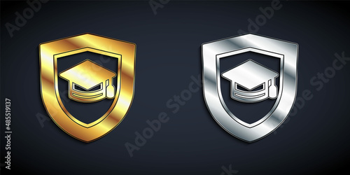 Gold and silver Graduation cap with shield icon isolated on black background. Insurance concept. Security, safety, protection, protect concept. Long shadow style. Vector