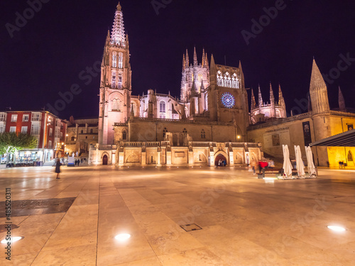 Spain, Castile and Leon, Burgos, Square in front of illuminated Cathedral of Saint Mary of Burgos at night photo