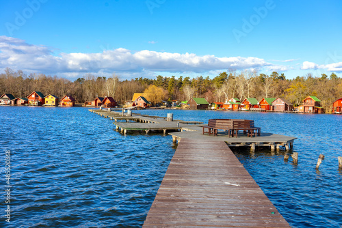 Derito to lake in Tata Hungary with cute colorful fishing cabins photo