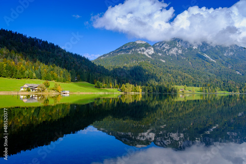 Austria, Tirol, Scenic view of Kaiser Mountains reflecting in HintersteinerSee lake photo