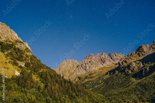 Caucasus mountain range with star field at night, Sochi, Russia photo