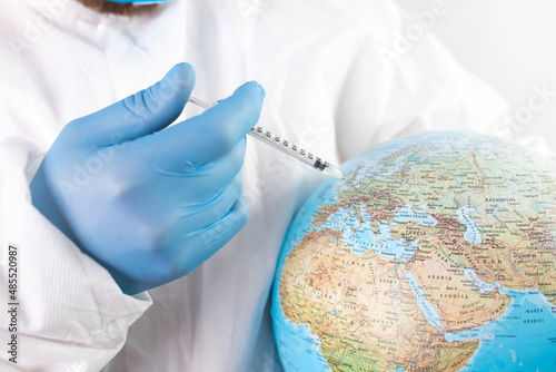 Doctor vaccinating the earth because of coronavirus