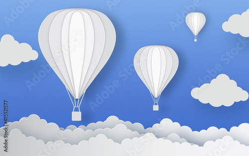 Hot air balloons and clouds on blue paper background