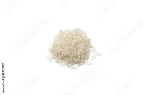 Heap of long grain rice on white background, top view.