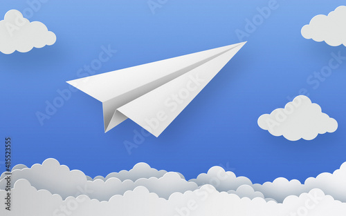 Paper plane and clouds on a blue sky