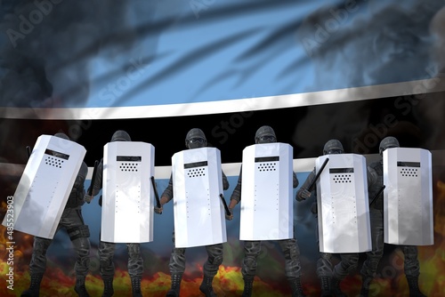 Botswana protest fighting concept, police officers in heavy smoke and fire protecting government against disorder - military 3D Illustration on flag background