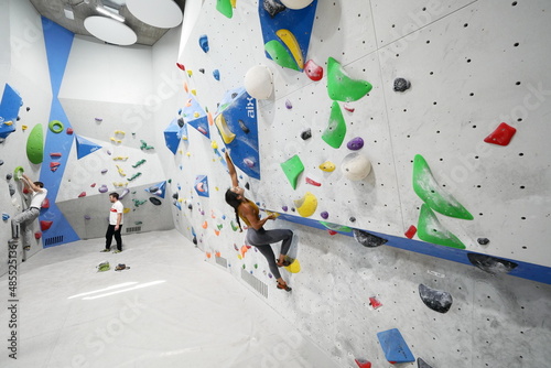 Young girl bouldering photo