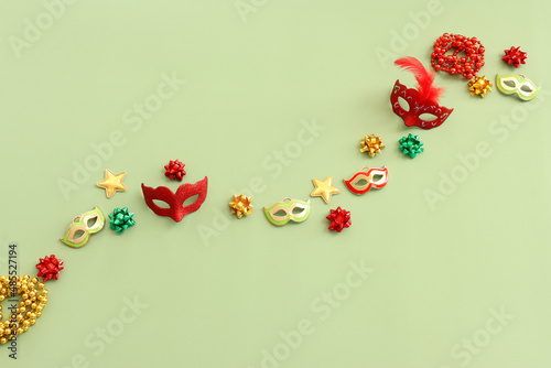 Holidays image of party colorful objects over green background. view from above
