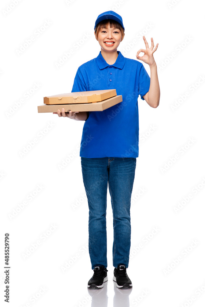 food, service and job concept - happy smiling delivery woman in blue uniform with takeaway pizza boxes over white background food, service and job concept - happy smiling delivery woman in blue uniform with takeaway pizza boxes over white background