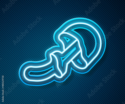 Glowing neon line Psilocybin mushroom icon isolated on blue background. Psychedelic hallucination. Vector