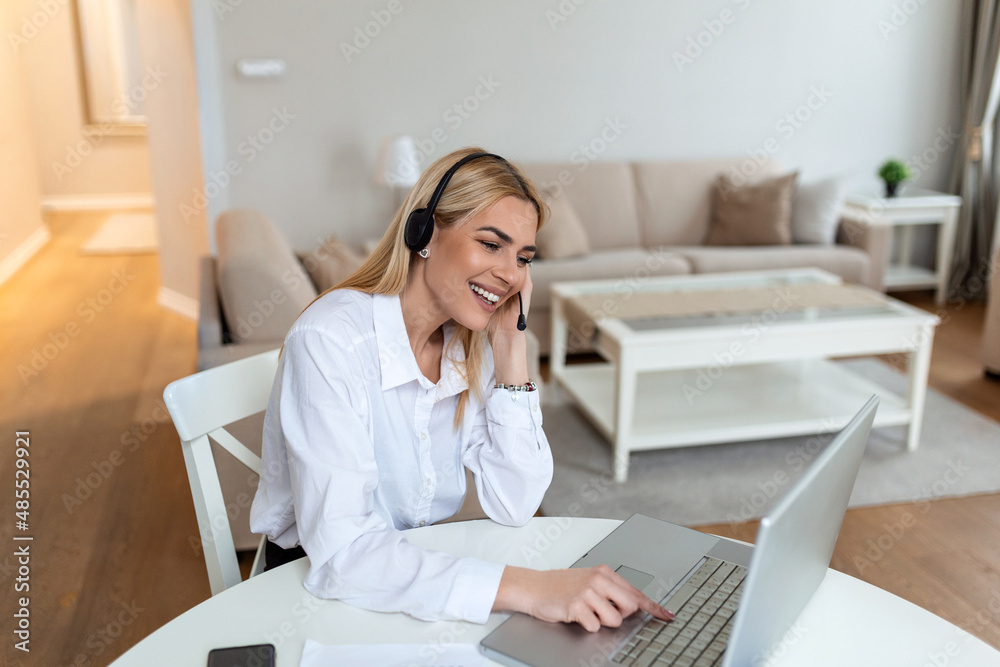 Call center agent with headset working on support hotline in modern office with copy space. Portrait of mature positive agent in conversation with customer Call center agent with headset working on support hotline in modern office with copy space. Portrait of mature positive agent in conversation with customer