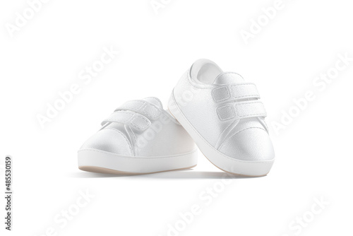 Blank white baby shoes pair mockup on tiptoe, half-turned view