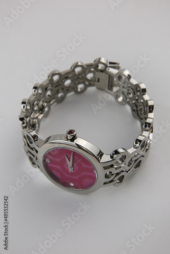  fashion women's wristwatch close-up on white background, blurred