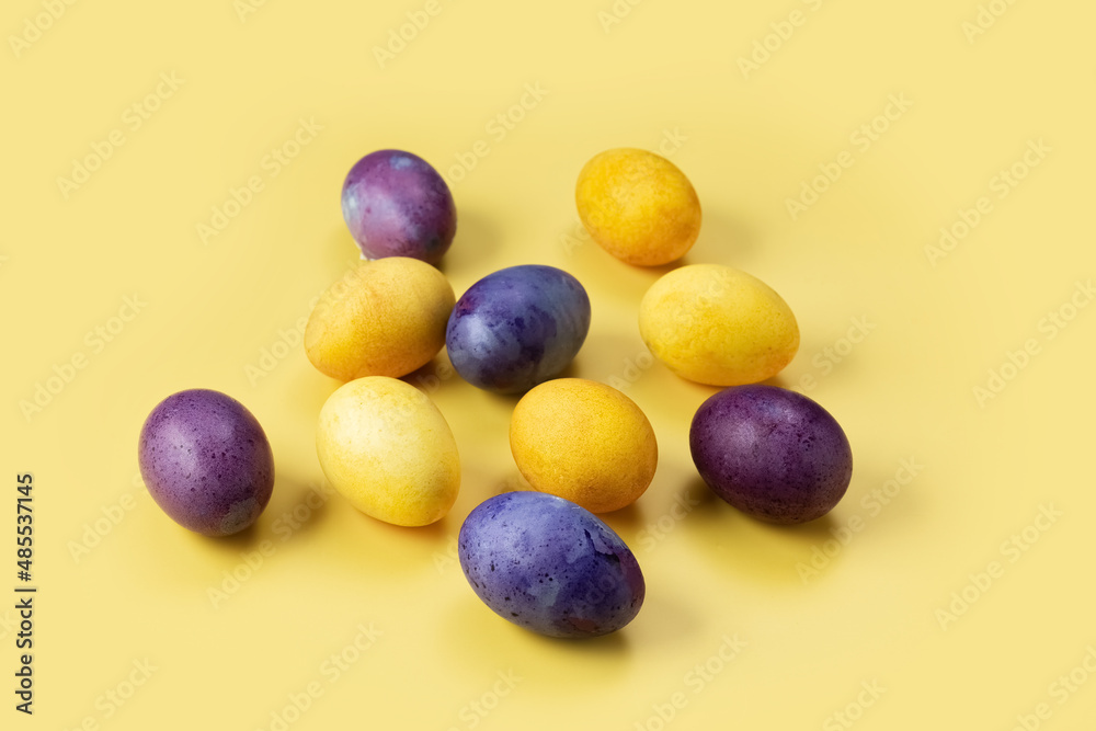Easter eggs on a yellow background. Concept. Painted colorful eggs. Photo Easter eggs on a yellow background. Concept. Painted colorful eggs. Photo