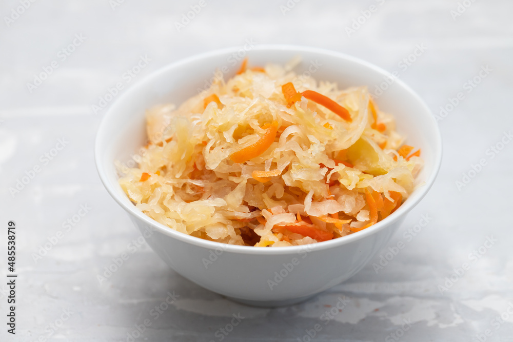 salted cabbage with carrot in white bowl salted cabbage with carrot in white bowl