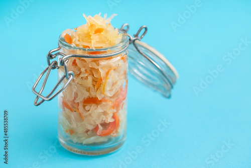 salted cabbage with carrot in glass jar
