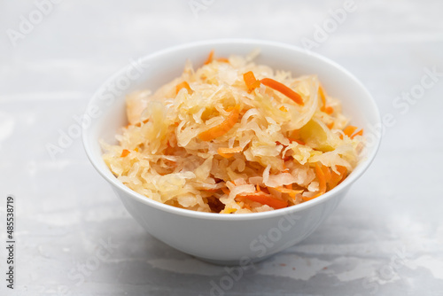 salted cabbage with carrot in white bowl