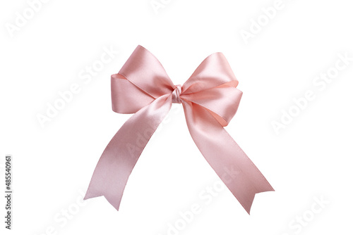 Pink bow isolated on white background. A product made of satin ribbon for decorating a gift.