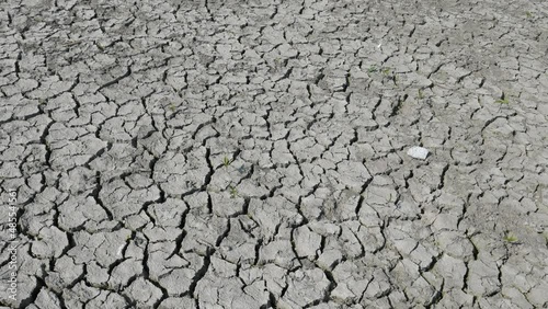 Lifeless desert land dry lake bed with cracked ground. Drought and crisis environment. Global warming. Waterless soil due lack of moisture