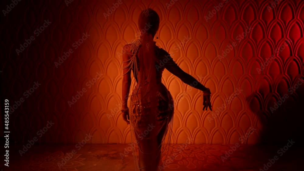 oriental fairytale and fantasy, sexy woman in candid dress is dancing in room of ancient palace
