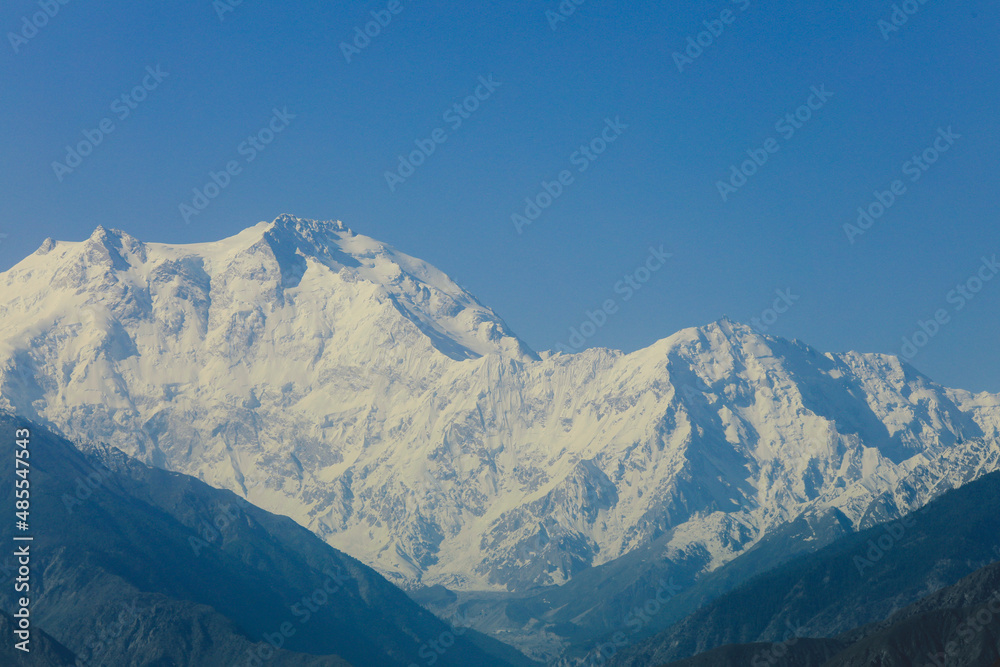 Amazing View to the Snow Capped Mountain Peaks in the Gilgit Baltistan Highlands under the Blue Sky, Pakistan