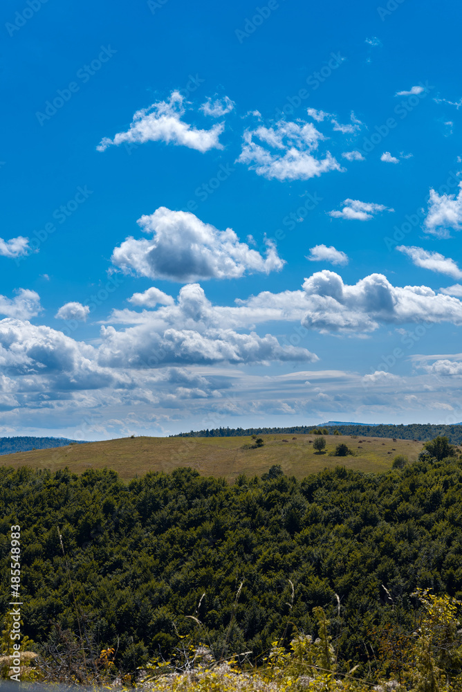 Mountain meadows with blue sky and green garss from the hill