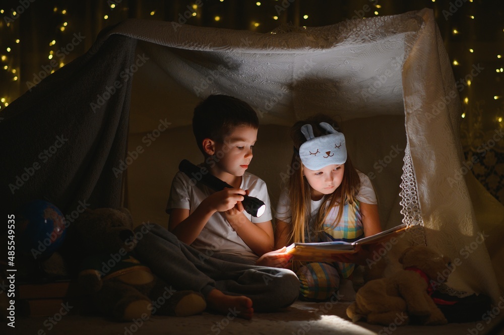 Little children reading bedtime story at home Little children reading bedtime story at home