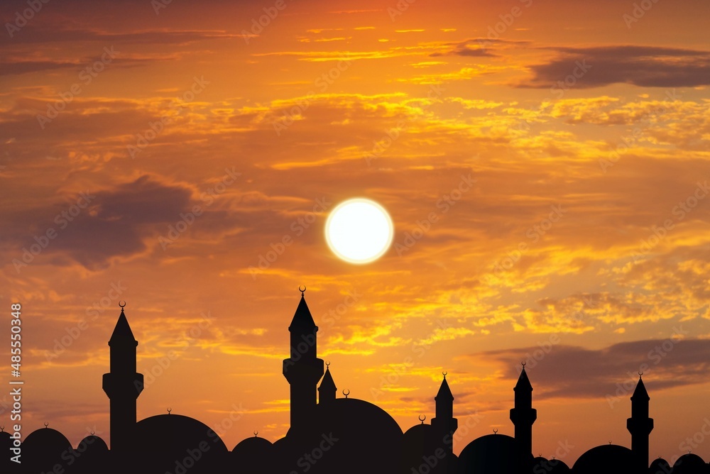 silhouette of a beautiful mosque against the background of sunset sun