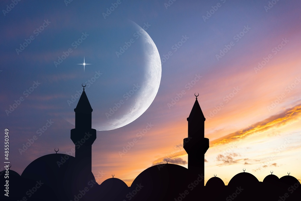 silhouette of a beautiful mosque against the background of sunset sun
