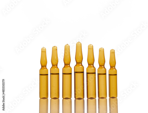 glass ampoules on white background and reflection     