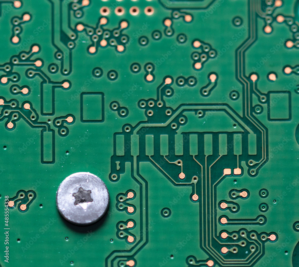 The printed circuit board is green in close-up The printed circuit board is green in close-up