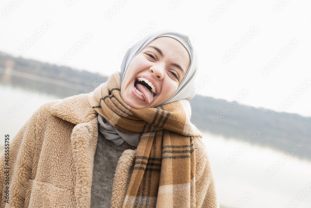 Young woman making funny expressions with her face Young woman making funny expressions with her face