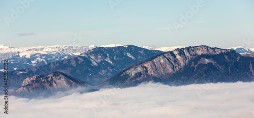 mountain peaks Roethelstein and Rote Wand above sea of fog in Styria, Austria